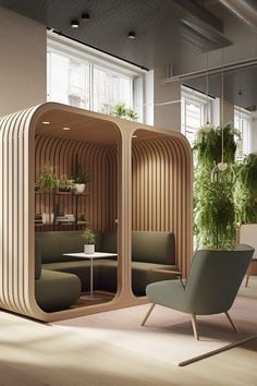 an office with wooden partitions and green plants in the corner, along with two chairs