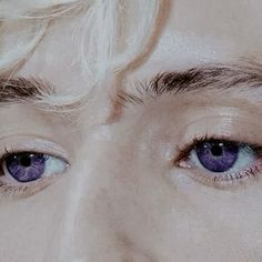 a man with blonde hair and blue eyes