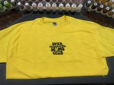 Machine embroidered Over Stimulated Moms Club t-shirt. Offered in unisex sizes s-xxl in yellow, white, or black! Over Stimulated, Bunker Hill, Club T Shirt, Moms Club, Yellow White, Gender Neutral, Bathing Beauties, Adult Outfits, Tops & Tees