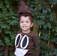 a young boy dressed up in a costume