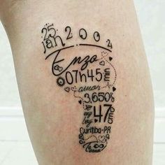 a person with a tattoo on their leg that has numbers and words written in it