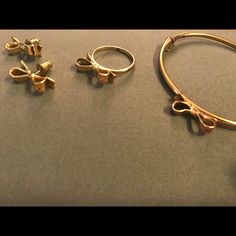 Get All 3! Kate Spade Gold Earrings, Bracelet And Ring. Ring Is Size 8. Not New. Signs Of Wear On Bracelet And Ring. Slight Pinkish Tarnish On Bow Of Bracelet And On Bow Of Ring And On Back On Ring. Earrings Never Worn. All Are Authentic And Have Kate Spade And/Or Marking. Each Retails For Almost $100 Each, So Great Steal For The Set! A Delicate Classic Set That You Will Get A Lot Of Use Of. Combo Looks Great Together. Kate Spade Gold Jewelry For Formal Occasions, Formal Gold Jewelry By Kate Spade, Kate Spade Silver Jewelry For Formal Occasions, Kate Spade Metal Jewelry As A Gift, Kate Spade Formal Jewelry With Matching Earrings, Kate Spade Sterling Silver Jewelry Gift, Kate Spade Silver Wedding Jewelry, Kate Spade Metal Jewelry For Gift, Kate Spade Silver Formal Jewelry