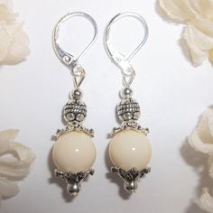 You Will Love The Neutral Color Of This Beaded Earring Set. Brand New & Hand Made By Me - Wvluckygirl. Done With Cream Beige Acrylic Beads And Antiqued Silver Toned Costume Jewelry Beads. The Pair Dangle & Drop From 925 Sterling Silver Lever Backs For Women's Pierced Ears. 1 5/8 Inches Tall & 3/8 Inch Wide. Each Single Earring Weighs 2.0 Grams. Lightweight! Would Make A Fabulous Gift Idea For Her! Fashion Accessory Dangly Dangling Elegant Sophisticated Timeless Classy Classic Piece Everyday Nwt Nickel-free Elegant Beaded Earrings, Silver Beaded Pearl Drop Earrings As Gift, Elegant Nickel-free Beaded Earrings As Gift, Elegant Nickel Free Dangle Beaded Earrings, Elegant Nickel-free Beaded Earrings For Gift, Elegant Nickel-free Dangle Beaded Earrings, Pearl White Round Beads Earrings, Elegant Nickel-free Beaded Earrings, Pearl White Round Beaded Earrings