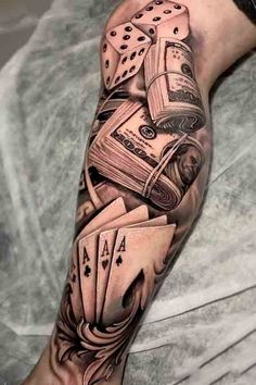 a man's arm with playing cards and dice on it