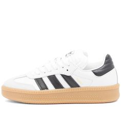 After making their name in sports, the adidas Samba’s are now seen as fashion-forward in numerous subcultures. Vintage inspired, these shoes are still making an impression. With minimalist design detailing, a full leather upper is accented by a nubuck toe cap whilst three stripe detailing appears in a contrasting colour. Underneath a slightly thicker gum rubber outsole gives these shoes a slight lift..Leather Upper.Lace Closure.Rubber Outsole.Shop All Adidas Sneakers Adidas Skate Shoes With Gum Sole For Streetwear, Adidas Skate Shoes With Rubber Waffle Outsoles, Adidas White Skate Shoes With Rubber Waffle Outsoles, Adidas High-top Sneakers With Gum Sole And White Sole, Adidas Sporty High-top Sneakers With Gum Sole, Adidas Skate Shoes With Gum Sole For Sports, Adidas Primeknit, Round Toe Sneakers, Chain Strap Bag