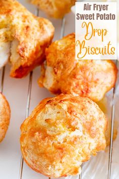 some food that is on a rack with the words air fryer sweet potato drop biscuits