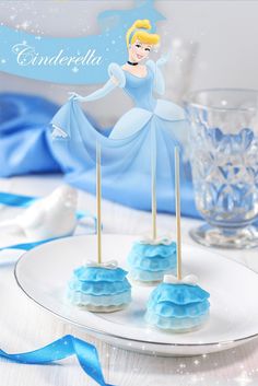 there are some blue cake pops on the plate