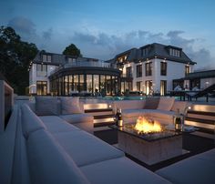 a fire pit sitting on top of a white couch