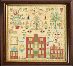 a cross stitch pattern with houses and trees