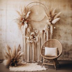 a room with a chair, rug and some feathers on the wall next to it