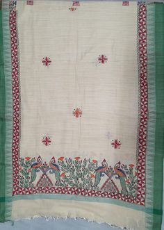 an old cloth with birds and flowers on it