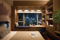 a bed room with a neatly made bed next to a window and a book shelf