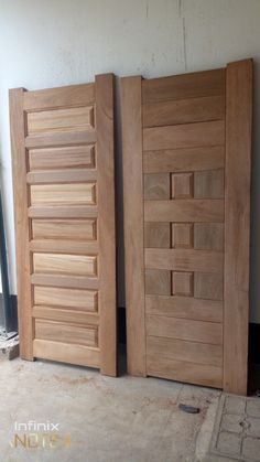 two wooden doors sitting next to each other