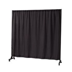 a black curtain is hanging on a white wall and it's attached to a metal stand