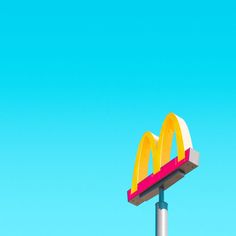 a mcdonald's sign is shown against a blue sky