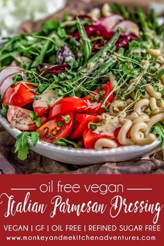 a plate full of pasta and vegetables with the words oil free vegan italian parmesan dressing