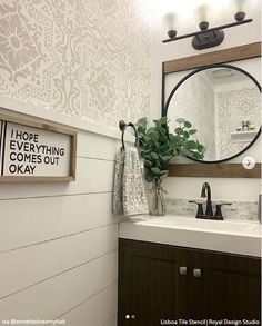 a bathroom sink with a mirror above it and a sign on the wall that says hope everything comes out okay