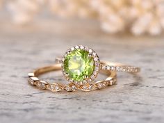 Ring Information---- Main Stone : *7mm Round Cut Peridot Side Stone: * Round Cut SI-H Diamonds * Approx weight: 0.21ct Metal: * Solid 14K yellow gold If you would like to purchase the peridot ring only,please check this link: Peridot Engagement Rings Gold, Wedding Peridot Diamond Ring In Yellow Gold, Yellow Gold Peridot Diamond Wedding Ring, Wedding Jewelry With Peridot In Halo Setting, Green Round Bridal Sets For Wedding, Peridot Diamond Wedding Ring, Fine Jewelry Peridot Diamond Wedding Ring, Classic Wedding Diamond Ring With Peridot, Green Peridot Diamond Wedding Ring