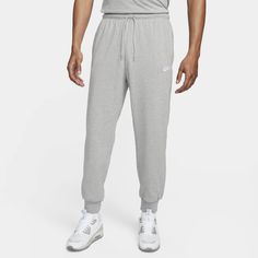 East to style and comfortable to wear, our Nike Club knit joggers are ready to become a versatile piece of your casual wardrobe. The relaxed fit is designed to give you a bit of room through the seat and thighs. The slight taper and ribbed ankle cuffs keep it clean around your sneakers. Pull them on with a tee or your favorite hoodie for casual, everyday wear. Nike Casual Sweats With Ribbed Cuffs, Casual Nike Sweats With Ribbed Cuffs, Nike Joggers With Ribbed Waistband For Jogging, Nike Casual Pants For Jogging, Casual Nike Pants For Jogging, Casual Gray Joggers With Ribbed Cuffs, Nike Cotton Sweats With Elastic Waistband, Nike Cotton Pants With Ribbed Cuffs, Nike Casual Joggers With Comfort Waistband