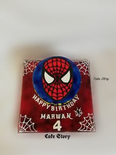 a spiderman birthday cake with the number 4 on it