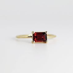 This beautiful Emerald Cut Garnet Gold Ring was handmade in Melt'm Jewelry Design Studio in California using 14k solid yellow gold band and 6x4mm emerald cut natural garnet stone. Garnet is featuring in 14k gold prong setting. DETAILS ABOUT THE RING, MATERIAL AND STONES Ring Band: 14K solid gold Ring Band size: 1 mm thick Gemstone: Garnet Garnet size: 6mm x 4mm emerald cut It is a great birthday gift for your special ones whose birthday are in January, since Garnet is January birthstone. This so Classic Stackable Birthstone Ring With Emerald Cut, 14k Gold Ruby Ring With Bezel Setting, Emerald Cut, Emerald Cut Solitaire Ruby Ring In Fine Jewelry Style, Emerald Cut Red Birthstone Ring, Emerald Cut Garnet Gemstone Rings, Emerald-cut Garnet Gemstone Rings, Red Emerald Cut Birthstone Ring, 14k Gold Emerald Ring Radiant Cut For Gift, Emerald Cut Ruby Ring In 14k Gold