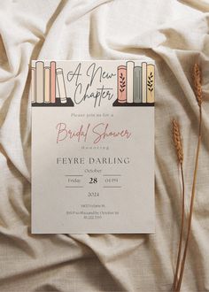 a book themed bridal shower is displayed on a bed with white sheets and pillows