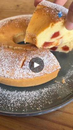 a donut with a bite taken out of it sitting on top of a plate