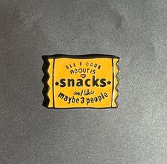 a yellow and black sticker that says, all i care about is snacks and like maybe 3 people