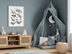 a child's room with blue walls and furniture, including a play tent in the corner