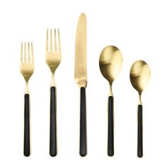 a set of five gold and black flatware with spoons, forks and knives