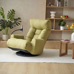 a living room with a chair, coffee table and bookshelf