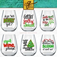 six wine glasses with different sayings on the bottom, and one has an image of a