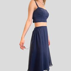 Best Seller - Tie Waist Overskirt in Indigo silk chiffon. Skirt is very versatile and can be worn over a slip, leggings, bathing suit, etc., or wear it as a slip. Pair it with one of our tops for a seamless dressed up look. Now available in Ivory, Indigo, Cloud Blue, Pistachio and Vintage Rose. One Size fits most. - princess seams - drawstring ties To prevent shrinkage, hand wash in cold water, hang to dry, or dry cleaning is recommended. Please email for additional information and before placin Knee-length Bottoms For Summer Evening, Flowy Summer Evening Skirt, Flowy Skirt For Summer Evenings, Flowy Evening Skirt For Summer, Summer Sheer Asymmetrical Skirt, Sheer Asymmetrical Skirt For Summer, Summer Evening Chiffon Skirt, Elegant Summer Two-piece Dress With Flowy Skirt, Summer Evening Skirted Bottoms