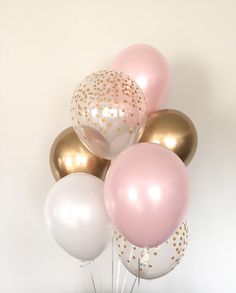 a bunch of balloons that are in the shape of polka dots on a white background