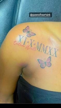 the back of a woman's stomach with butterfly tattoos on her upper arm and chest