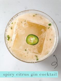 an overhead view of a drink in a glass with the text spicy citrus gin cocktail