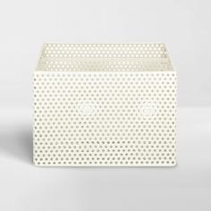 a white box with holes on it