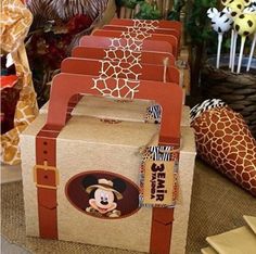 there are many cardboard boxes that have mickey mouse on the front and side of them