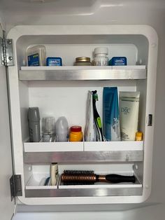 the inside of an airplane's compartment is full of hair products and other personal care items