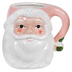 a pink and white santa claus mug with green leaves on the handle is shown in front of a white background