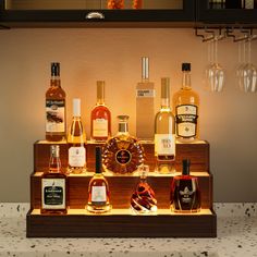 an assortment of liquor bottles on display in a bar