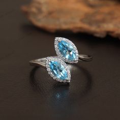 Natural Swiss Blue Topaz Ring, 925 Sterling Silver Ring, Cubic Zirconia Ring, Blue Topaz Band Ring, Statement Ring,  Thumb Ring Gift for Her, Stackable Ring, Women's Ring ★ PRODUCT DETAILS ★ * SKU:- RG-1819-SBT * Product:- Ring * Metal:- Sterling Silver * Metal Purity:- 925 * Gross Weight:- 2.86 Gms (Approx.) ★ STONE DETAILS ★ *  Stone Name:- Swiss Blue Topaz *  Stone Size:- 4x8mm *  Stone Weight:- 1.28 Cts (Approx.) *  Stone Shape:- Marquise *  Stone Color:- Sky Blue *  Stone Cut:- Faceted *  B Luxury Multi-stone Topaz Ring In Sterling Silver, Cluster Ring Engagement, Swiss Blue Topaz Ring, Ring Marquise, Blue Topaz Stone, Cubic Zirconia Rings, Ring Blue, Swiss Blue Topaz, Thumb Rings