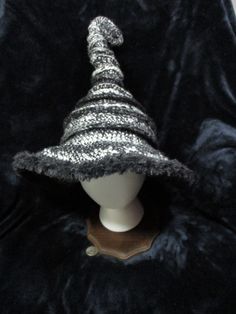 Fancy curly witch hat with fur trim Witchy Wide Brim Costume Hat For Winter, Witchy Wide Brim Hat For Winter, Witchy Wide Brim Winter Costume Hat, Witchy Winter Hats For Party, Whimsical Winter Costume Mini Hats, Whimsical Winter Mini Hats For Costumes, Winter Costume Party Hats With Curved Brim, Curved Brim Hats For Winter Costume Party, Curved Brim Hats For Costume Party In Winter