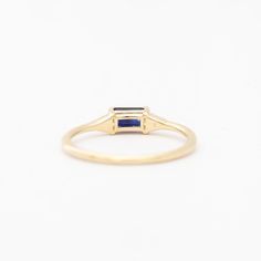 A azure blue sapphire set in Jennie Kwon's signature deco setting makes for a perfectly balanced piece that's deliciously dainty. Wear her as an alternative bridal ring—or on any finger, just because. Made in the U.S.A. 14 karat gold set with one 5 mm x 3 mm blue sapphire and two 1.2 mm diamonds. Jennie Kwon, Alternative Bridal, Deco Ring, Azure Blue, Bridal Ring, Gold Set, Bridal Rings, Emerald Cut, Blue Sapphire