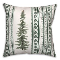 a green and white pillow with a christmas tree on it