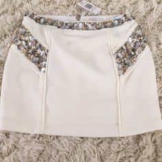 Nwt Ivory Mini Skirt With Stone Detailing. Great For A Fun Night Out Or A Fancy Dinner Party! Pair It With A Cute Top And Booties For A Perfect Look! Smoke Free Home. Fitted White Skirt For Night Out, Glamorous White Bottoms For Night Out, High-waisted White Mini Skirt For Party, White High-waist Mini Skirt For Party, White High Waist Mini Skirt For Party, White Stretch Mini Skirt For Night Out, Glamorous White Stretch Bottoms, White High Waist Skort For Party, White High-waisted Party Skort