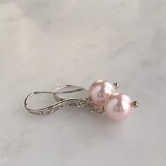 "- Silver, gold or rose gold - Choose your own Swarovski pearl color - 1\" length - .25\" width - Pearl measures 8mm - Comes in signature gift box - Easy returns If you are looking for a simple and classic pair of pearl earrings, these are perfect! The tiny Swarovski crystals in the ear wires offer a subtle shimmer to a timeless pearl drop style. Shop the whole collection: https://www.etsy.com/shop/TigerlillyCouture >> Join our mailing list << http://eepurl.com/cXRBGD" Elegant Rose Gold Pearl Earrings For Gift, Elegant Rose Gold Pearl Earrings As Gift, Elegant Hypoallergenic Rose Gold Jewelry, Hypoallergenic Rose Gold Earrings For Formal Events, Formal Rose Gold Sterling Silver Bridal Earrings, Elegant Pink Pearl Charm Jewelry, Classic Rose Gold Pearl Earrings For Parties, Feminine Rose Gold Pearl Earrings Gift, Elegant Hypoallergenic Bridal Earrings For Party