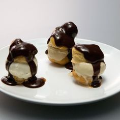 three ice cream sandwiches on a white plate