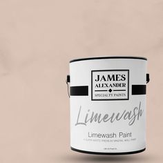 a white paint can with the words limewash painted on it's side, in front of a beige background