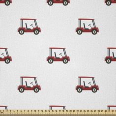 a white and red golf cart pattern on fabric